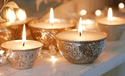 Candles in silver bowls