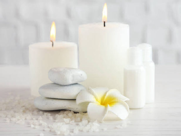 Candles and white marble stones